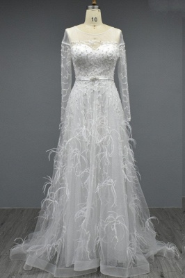 Белое свадебное платье трапециевидной формы с длинными рукавами и оборками_1