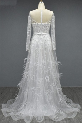 Белое свадебное платье трапециевидной формы с длинными рукавами и оборками_2